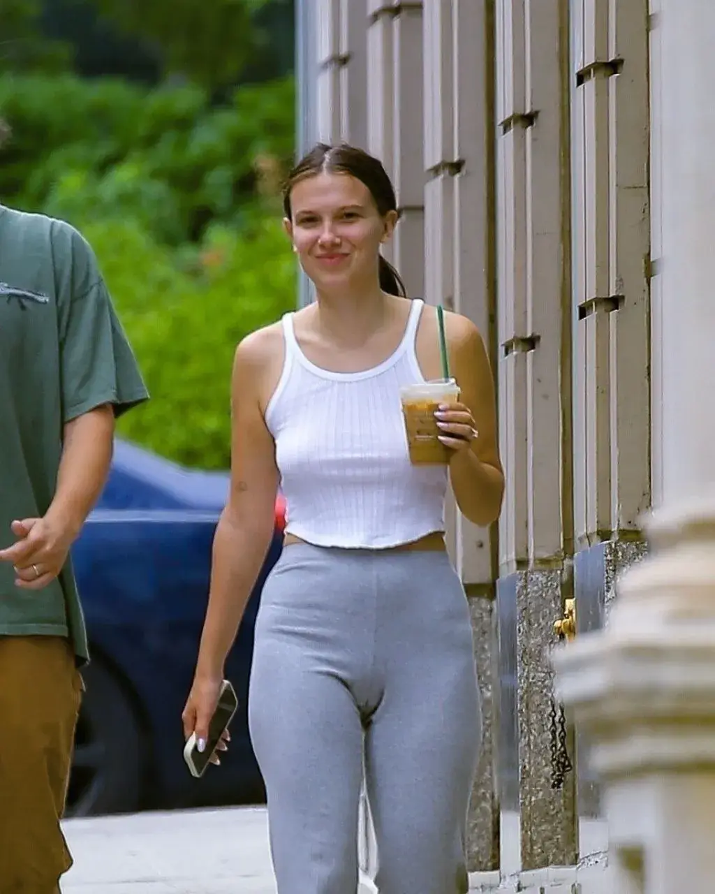 MILLIE BOBBY BROWN STILLS IN WHITE TOP BLUE JEANS IN NEW YORK